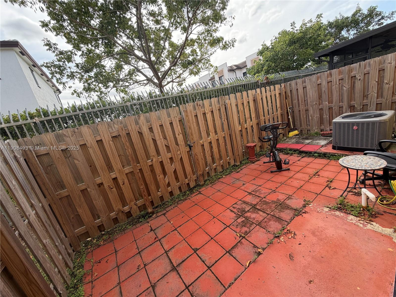 810 Northeast 212th Terrace, Unit 2 Miami, FL 33179 - Photo 41 of 44 a view of outdoor space with deck and furniture