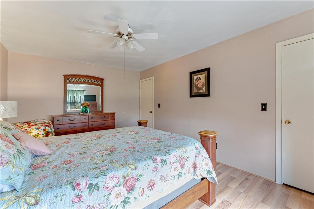 508 Joffre Bulger Road Joffre, PA 15053 - Photo 18 of 38 a bedroom with a bed and a chandelier