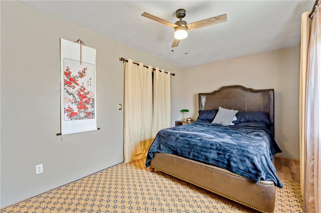 508 Joffre Bulger Road Joffre, PA 15053 - Photo 23 of 38 a bedroom with a large bed and a chandelier