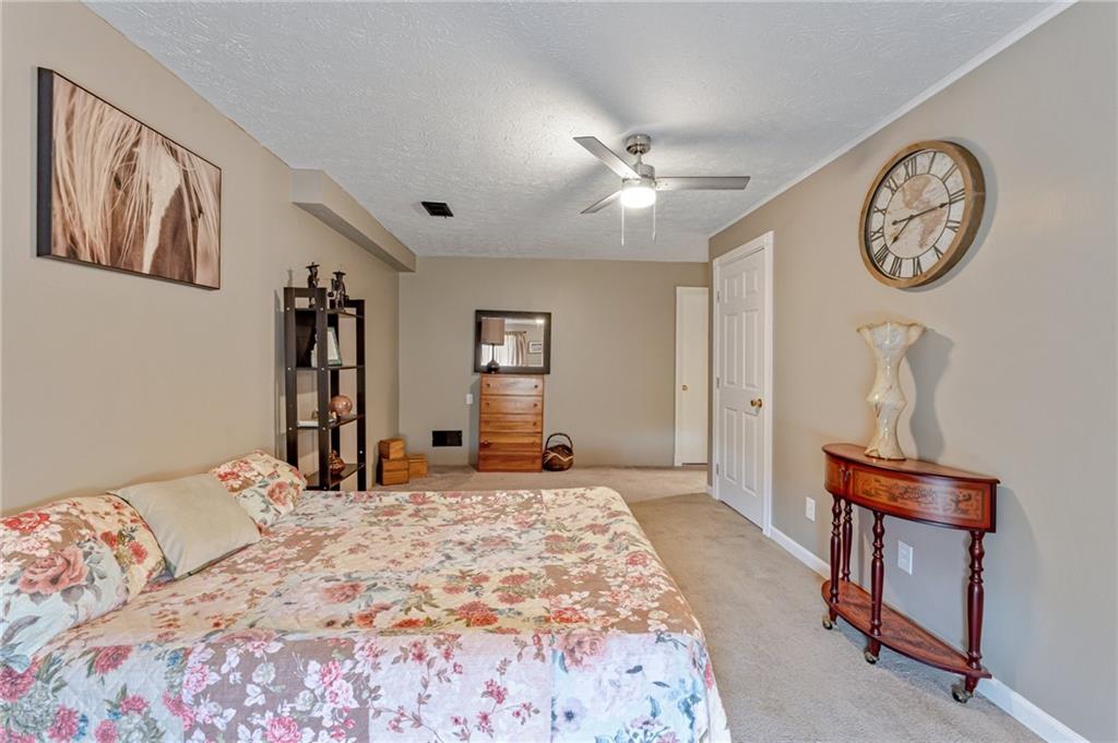 508 Joffre Bulger Road Joffre, PA 15053 - Photo 25 of 38 a bedroom with a large bed and a chandelier