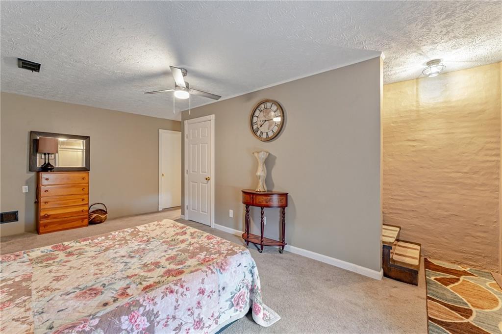 508 Joffre Bulger Road Joffre, PA 15053 - Photo 26 of 38 a bedroom with a bed and a chandelier