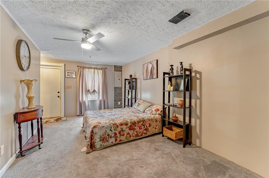 508 Joffre Bulger Road Joffre, PA 15053 - Photo 27 of 38 a bedroom with a bed and a chandelier