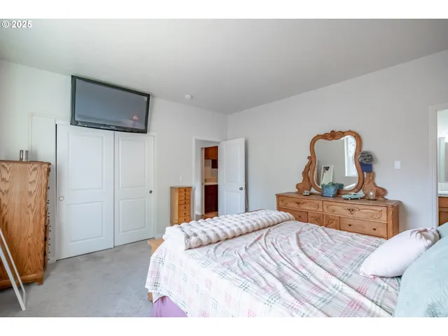 a bathroom with a double vanity sink toilet and shower