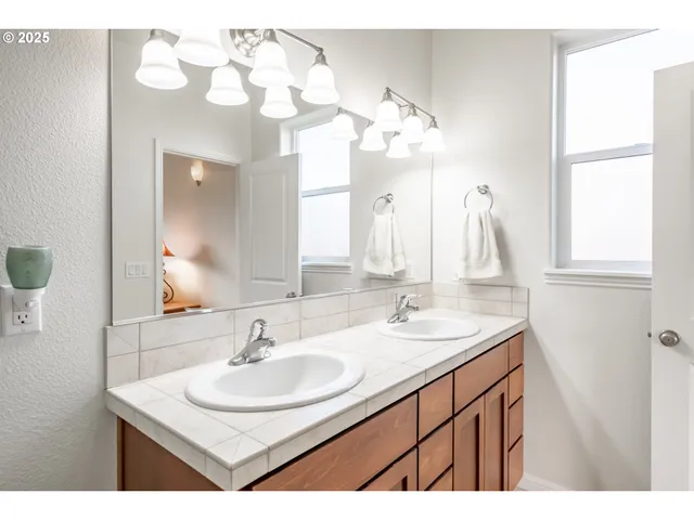 a building outdoor space with patio furniture and potted plants