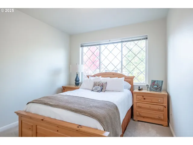 a bedroom with a bed and a lamp