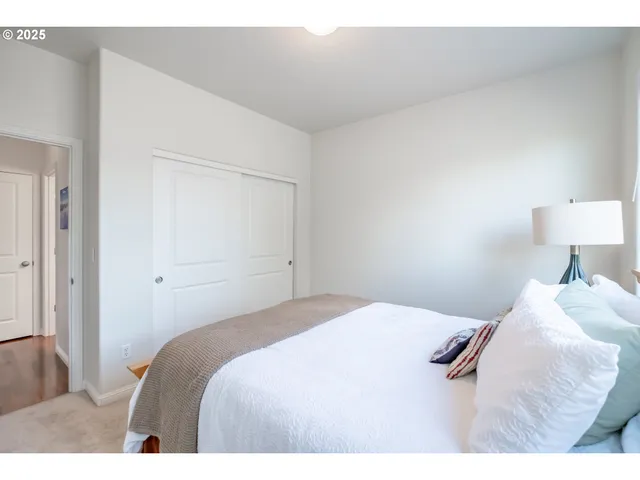 a bedroom with furniture and a window