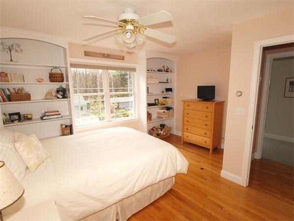 6 Spectacle Hill Road Bolton, MA 01740 - Photo 21 of 28 a spacious bedroom with a bed a dresser and a window