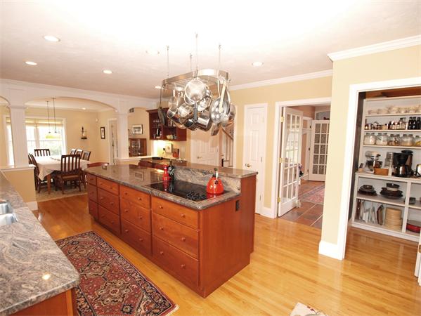 6 Spectacle Hill Road Bolton, MA 01740 - Photo 3 of 28 a kitchen with stainless steel appliances granite countertop a stove and a wooden floors