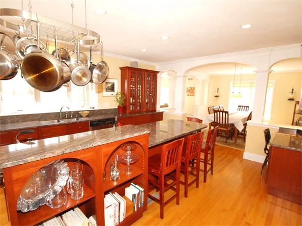 6 Spectacle Hill Road Bolton, MA 01740 - Photo 5 of 28 a dining hall with stainless steel appliances granite countertop a stove and a dining table with wooden floor
