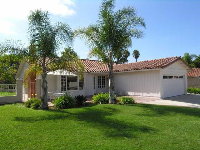 312 Sierra Ridge Drive Encinitas, CA 92024 - Photo 1 of 1 a front view of house with yard and green space