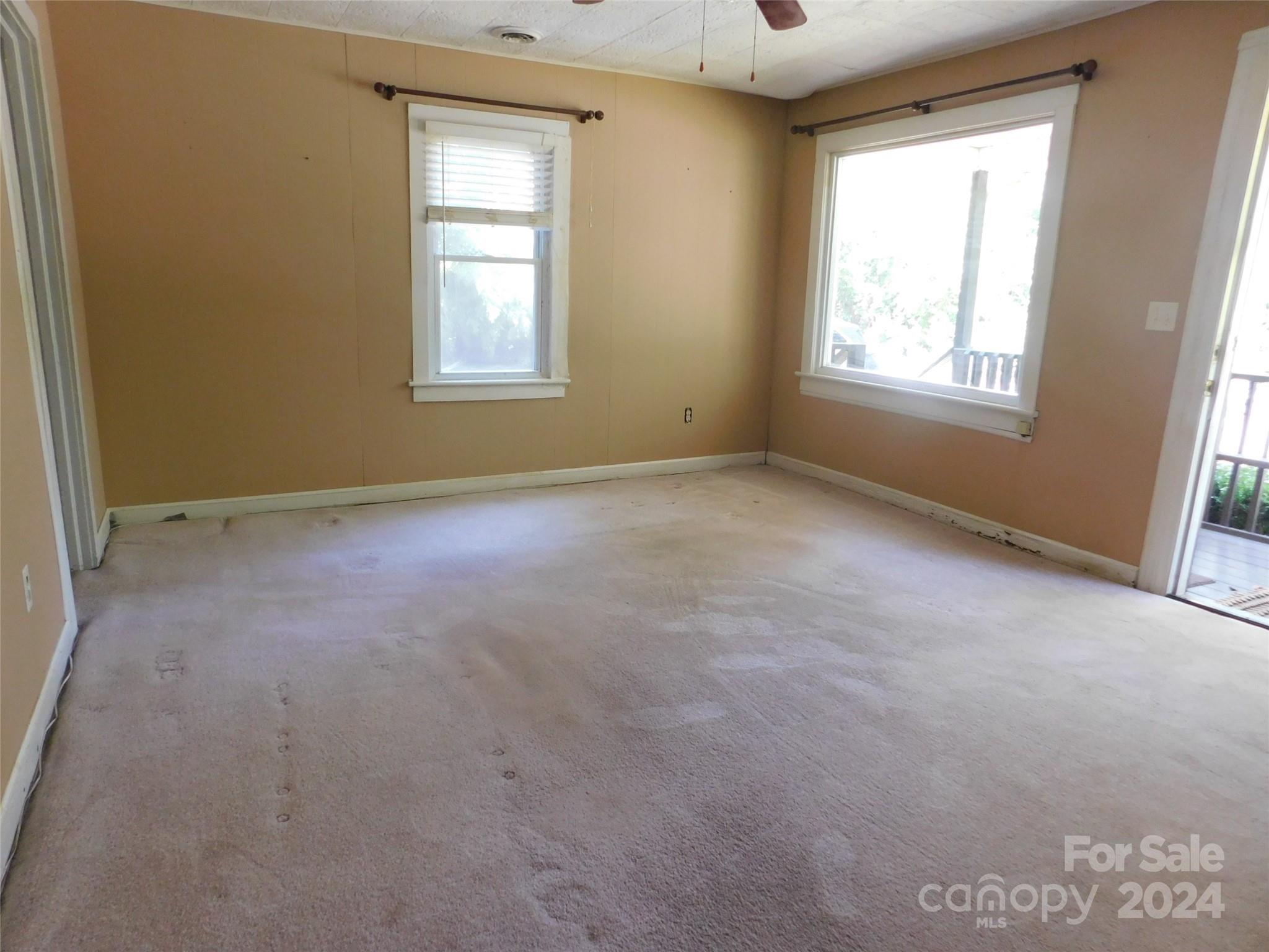 146 Browning Road Waynesville, NC 28786 - Photo 11 of 32 an empty room with windows