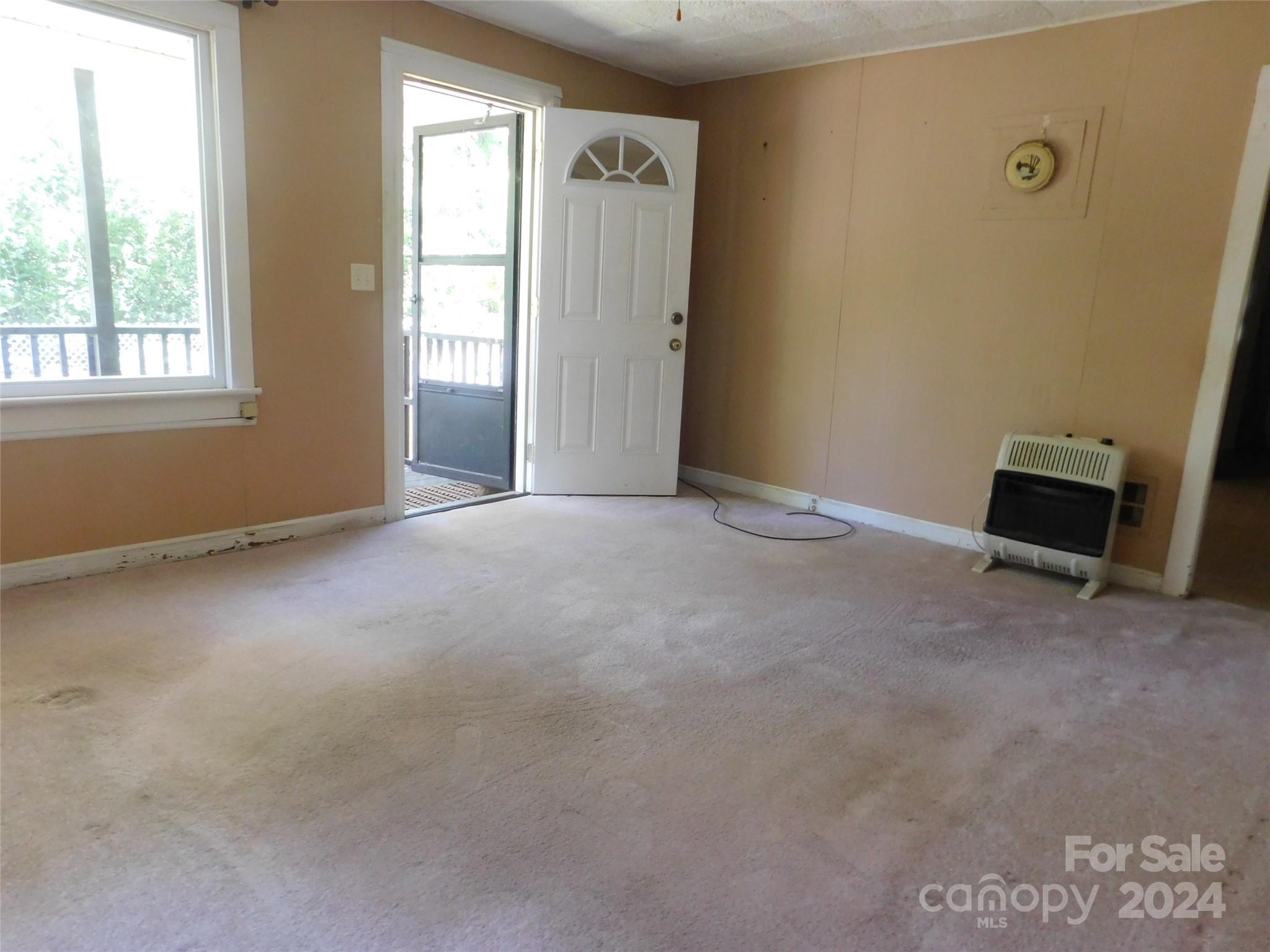 146 Browning Road Waynesville, NC 28786 - Photo 13 of 32 a view of an empty room with a window