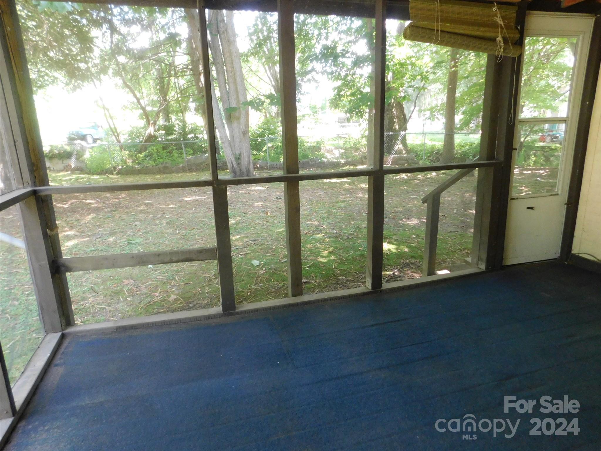 146 Browning Road Waynesville, NC 28786 - Photo 26 of 32 a view of a room with large windows