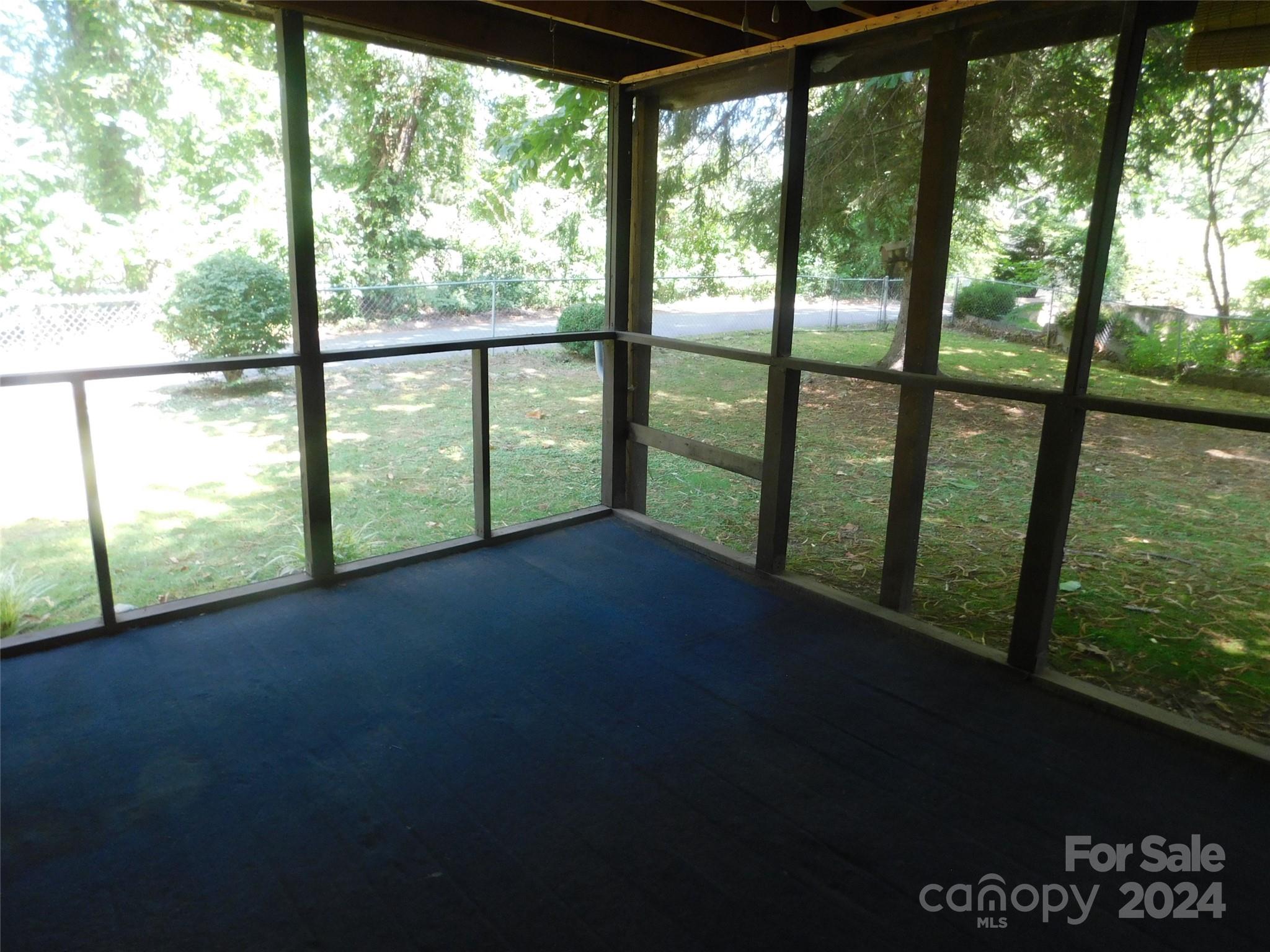 146 Browning Road Waynesville, NC 28786 - Photo 28 of 32 a view of hallway with a floor to ceiling window