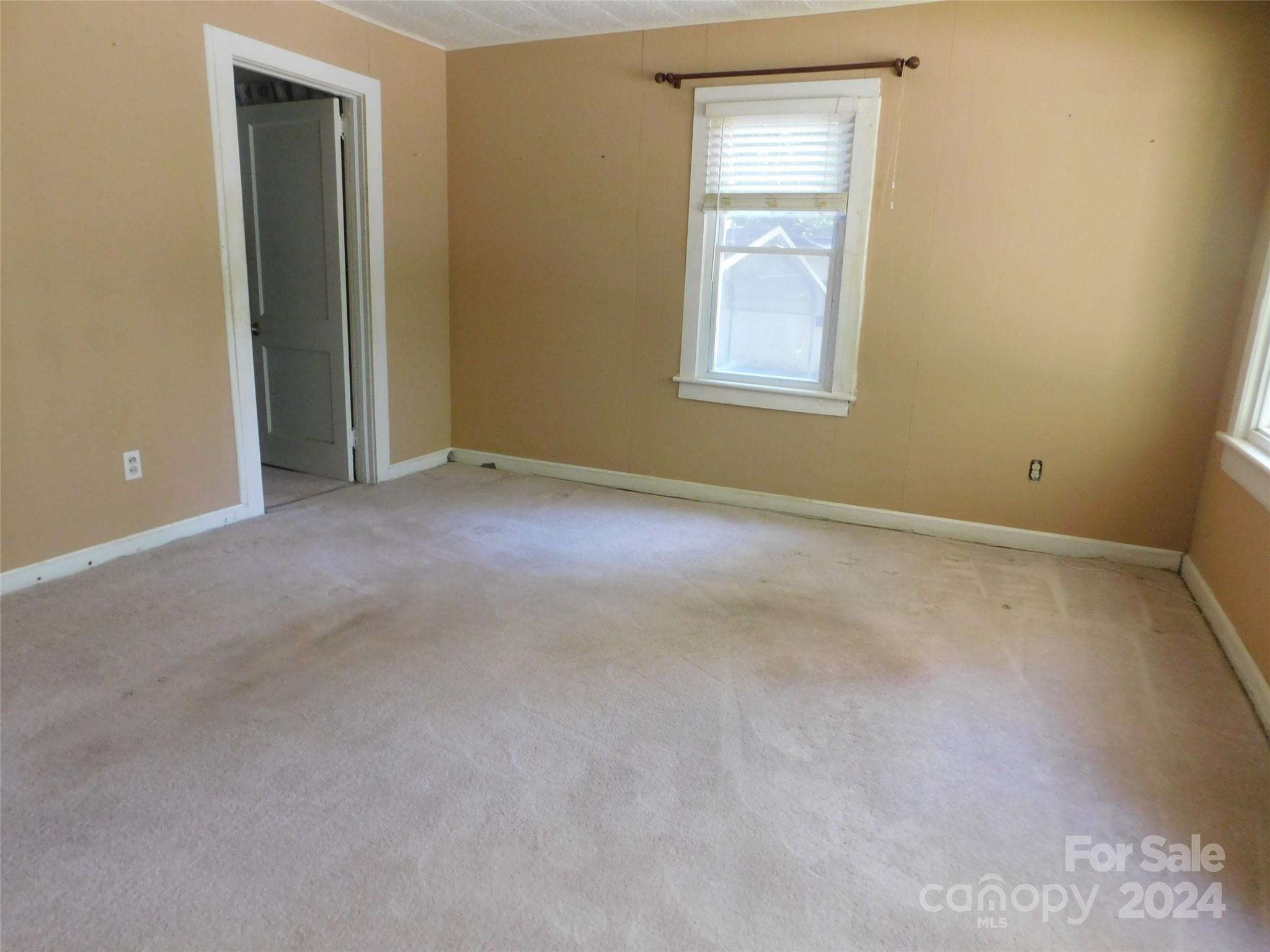 146 Browning Road Waynesville, NC 28786 - Photo 10 of 32 an empty room with windows and closet