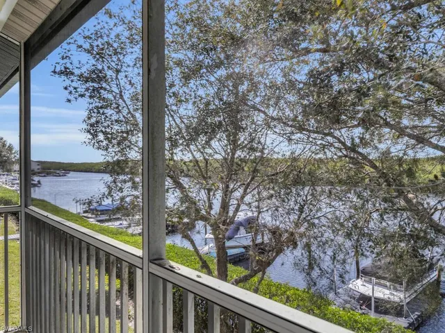 a living room with furniture ceiling fan and a window
