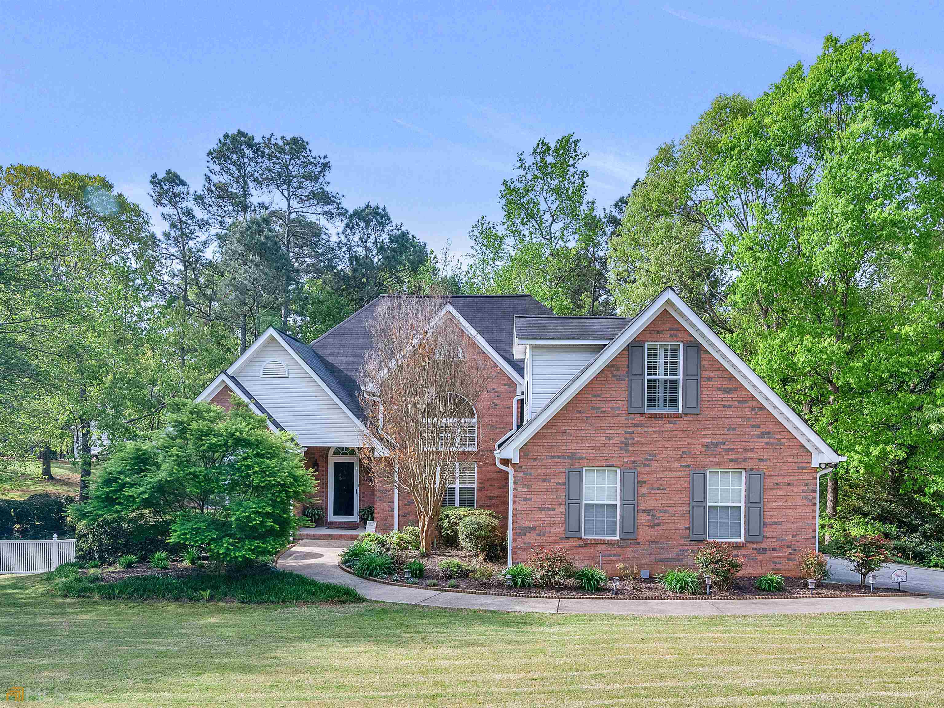 306 Oak Ridge Court Hampton, GA 30228 - Photo 1 of 1 a front view of house with yard and green space