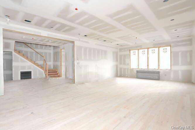 23 Northbrook Road, Unit 101 Spring Valley, NY 10977 - Photo 5 of 15 Unfurnished living room featuring hardwood flooring