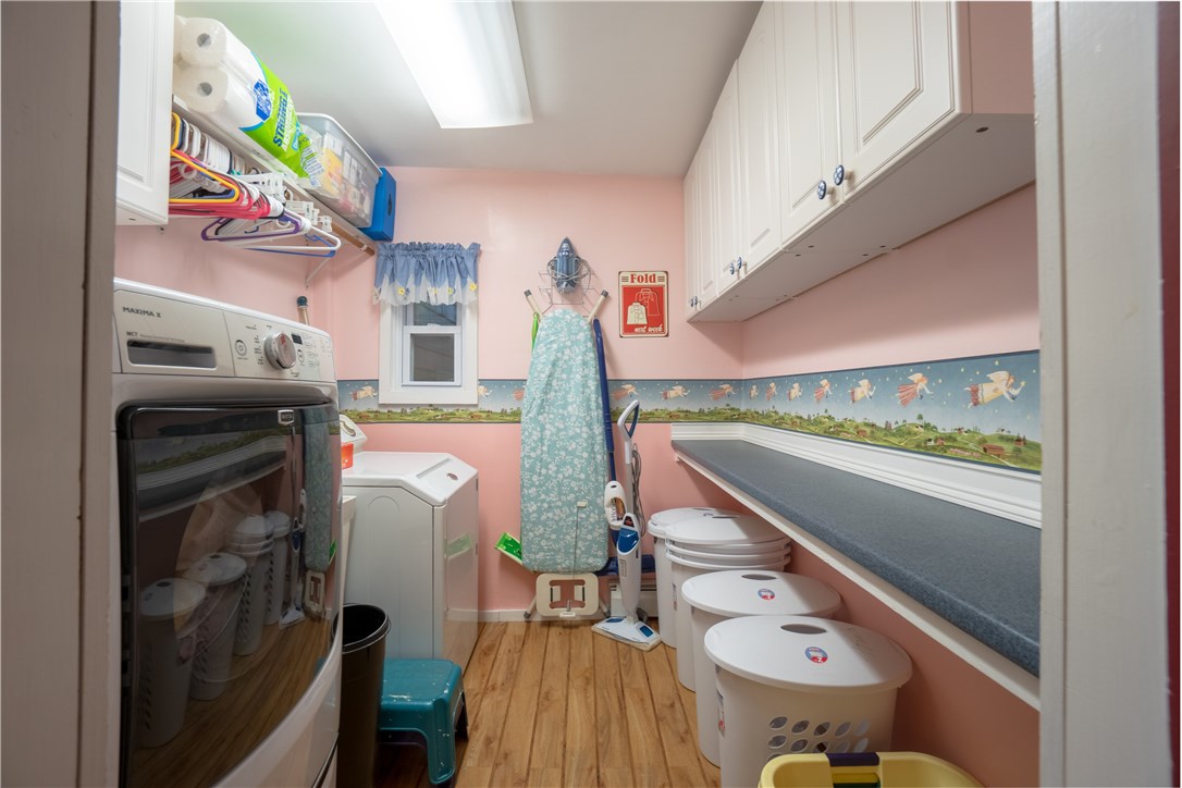 422 Waterman Hill Road Coventry, RI 02827 - Photo 19 of 39 Laundry Room with handy folding counter and storage!