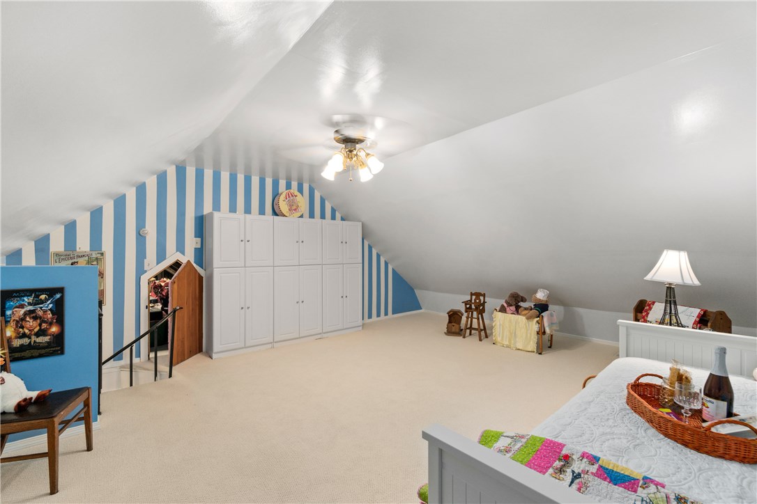 422 Waterman Hill Road Coventry, RI 02827 - Photo 20 of 39 Huge loft bedroom - also could be used as a child's play room, office, sewing room, etc. Small open door leads to attic storage which you can walk through to access the two other upper level bedrooms and full bath.