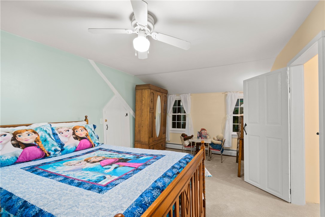 422 Waterman Hill Road Coventry, RI 02827 - Photo 22 of 39 Good size second floor bedroom - The smaller door to the left offers access to attic storage and walk through to the loft bedroom. This room also has brand new carpeting