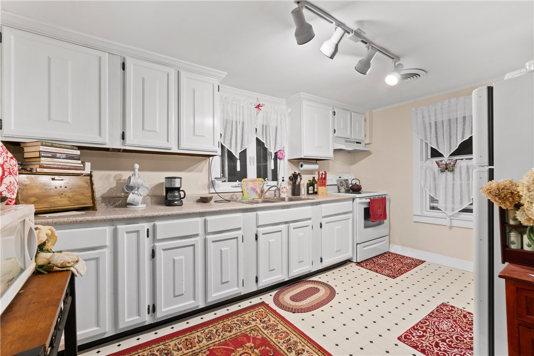 422 Waterman Hill Road Coventry, RI 02827 - Photo 29 of 39 Large kitchen in the Cottage. Stackable washer and dryer located beyond the refrigerator to the right