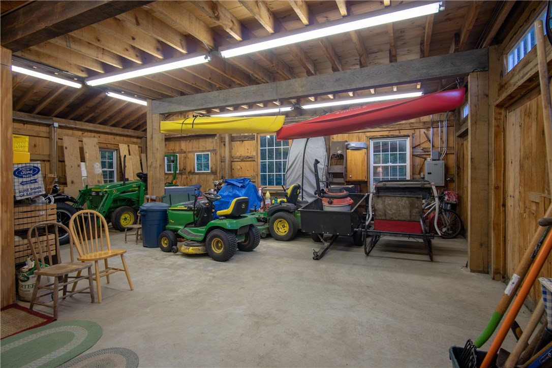 422 Waterman Hill Road Coventry, RI 02827 - Photo 33 of 39 Main floor of the 2000 sf barn/garage. There are 4 access points for ease of storing large items.