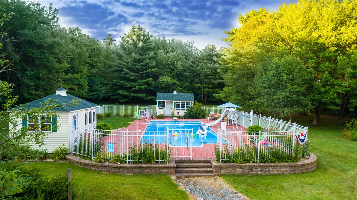 422 Waterman Hill Road Coventry, RI 02827 - Photo 35 of 39 Large, heated in-ground pool (44'x20' and 2 year old liner) with cabana to the left and a gardening shed straight ahead in photo. Pool has jumping board - not a diving board - and slide. There is also 18' of area in the shallow end for pool volleyball fun!
