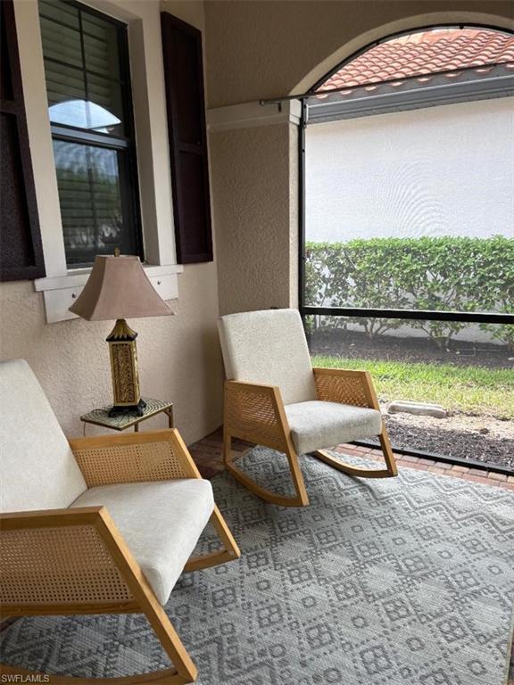 1599 Marton Court Naples, FL 34113 - Photo 19 of 22 a room with pool table and a floor to ceiling window