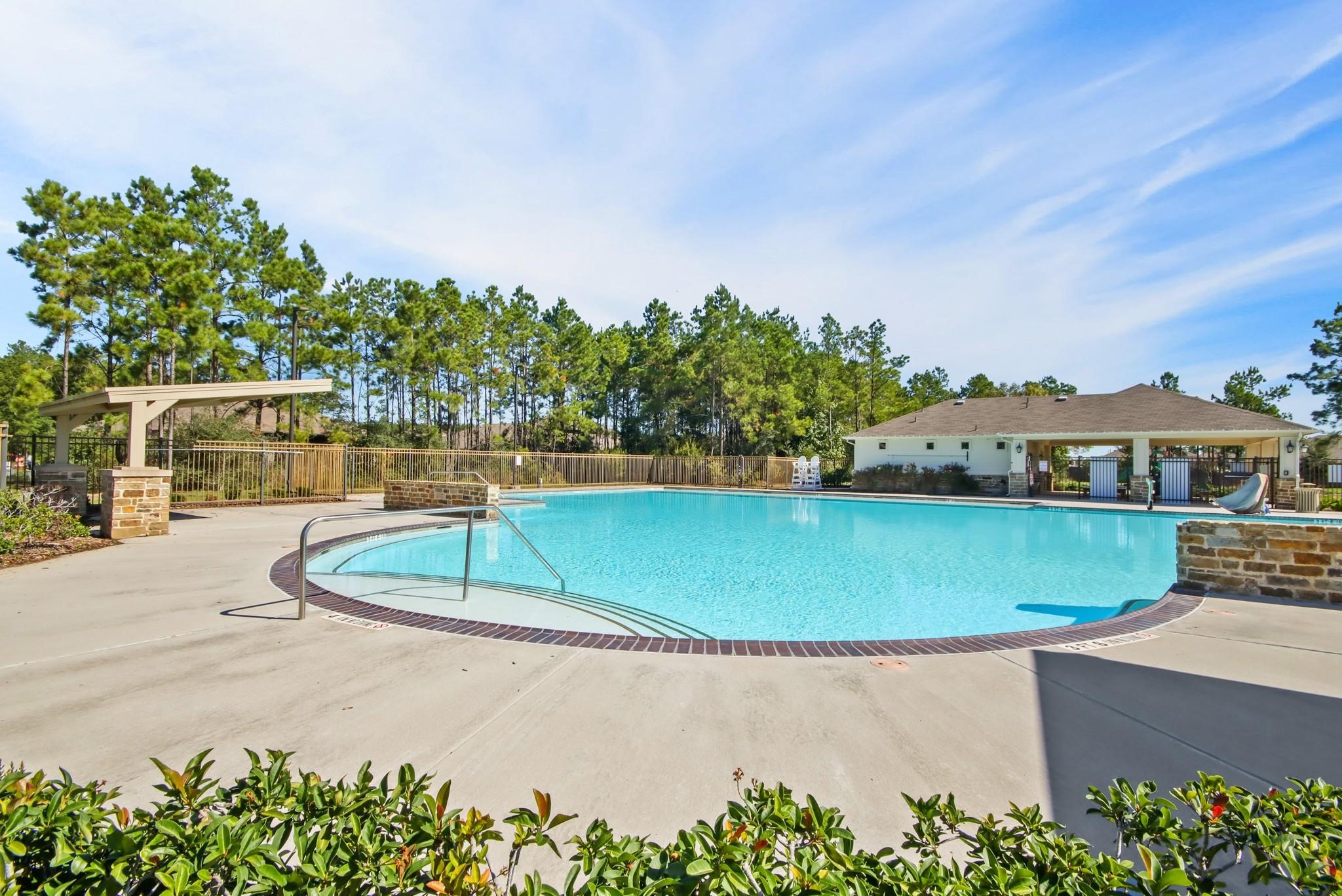 20004 Fibonacci Street New Caney, TX 77357 - Photo 16 of 21 a view of a swimming pool with a yard