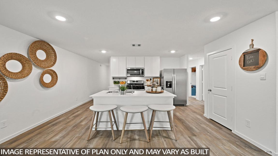 20004 Fibonacci Street New Caney, TX 77357 - Photo 4 of 21 a view of kitchen with cabinets and wooden floor