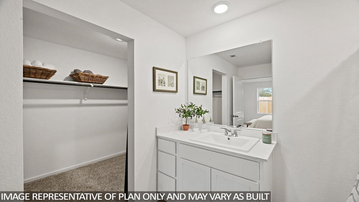 20004 Fibonacci Street New Caney, TX 77357 - Photo 9 of 21 a bathroom with a sink and a mirror