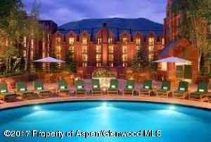 a view of swimming pool with an outdoor seating