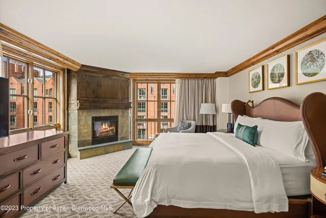 a bed room with a bed and a fireplace