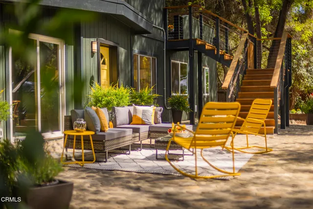 a view of a lounge chair and table in the patio