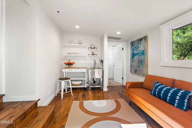 a living room with furniture and a couch