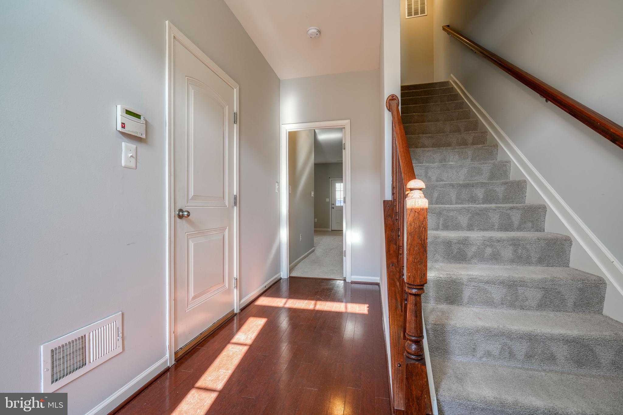 985 Morgan Run Road Middle River, MD 21220 - Photo 12 of 33 a view of a hallway with wooden floor and staircase