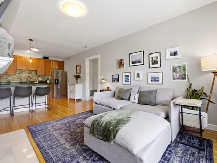 a living room with furniture and a rug