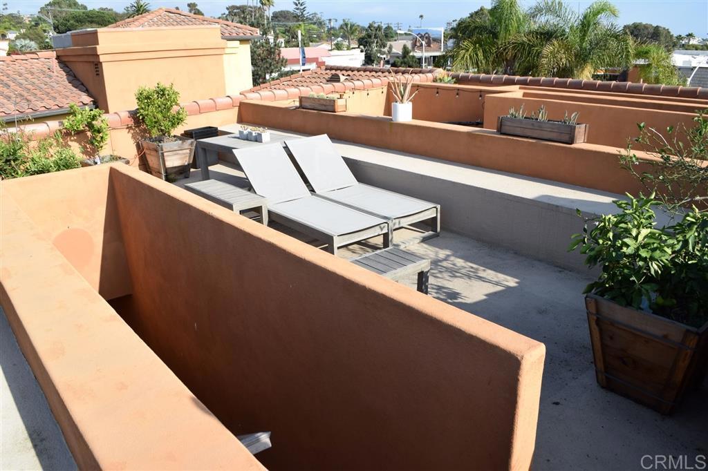 366 Forward Street, Unit E La Jolla, CA 92037 - Photo 21 of 26 a view of a balcony with couches and wooden floor