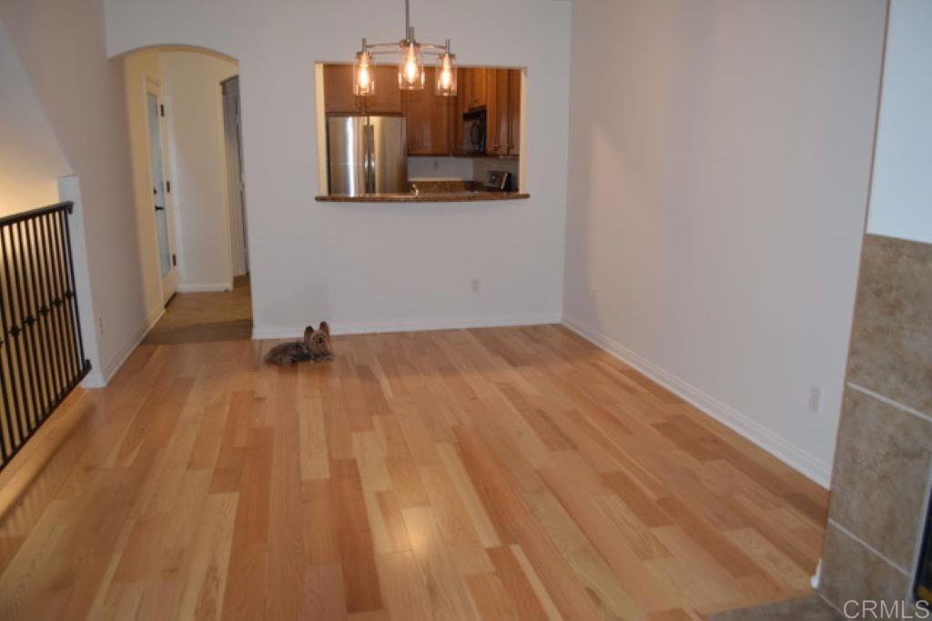 366 Forward Street, Unit E La Jolla, CA 92037 - Photo 3 of 26 a view of a room with wooden floor and wardrobe