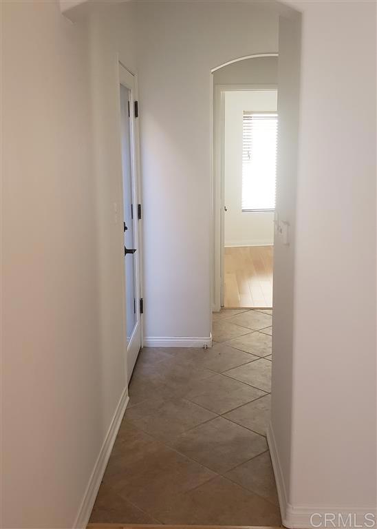 366 Forward Street, Unit E La Jolla, CA 92037 - Photo 6 of 26 an empty room with an entryway door