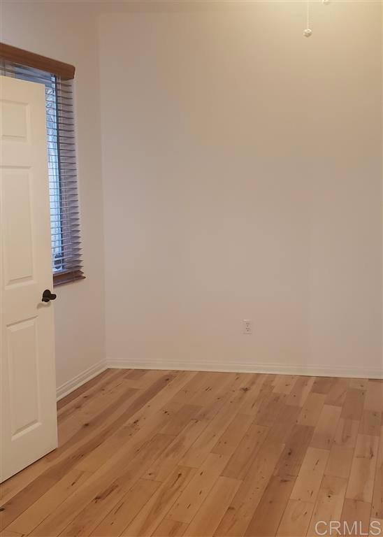 366 Forward Street, Unit E La Jolla, CA 92037 - Photo 7 of 26 wooden floor in a empty room