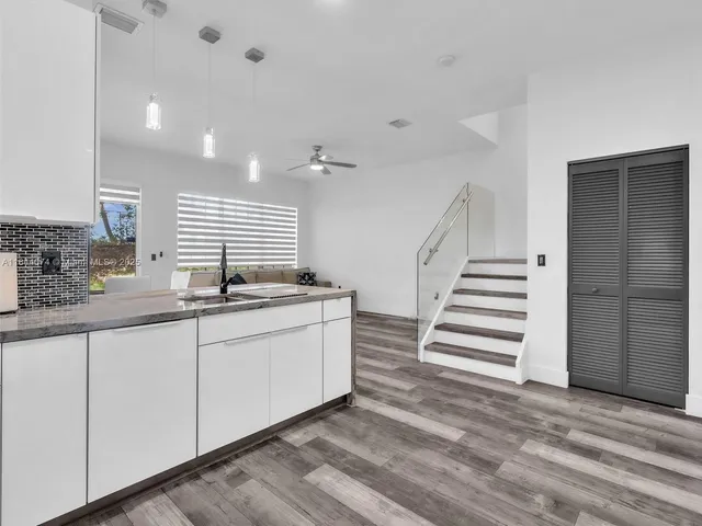 a kitchen with sink and window