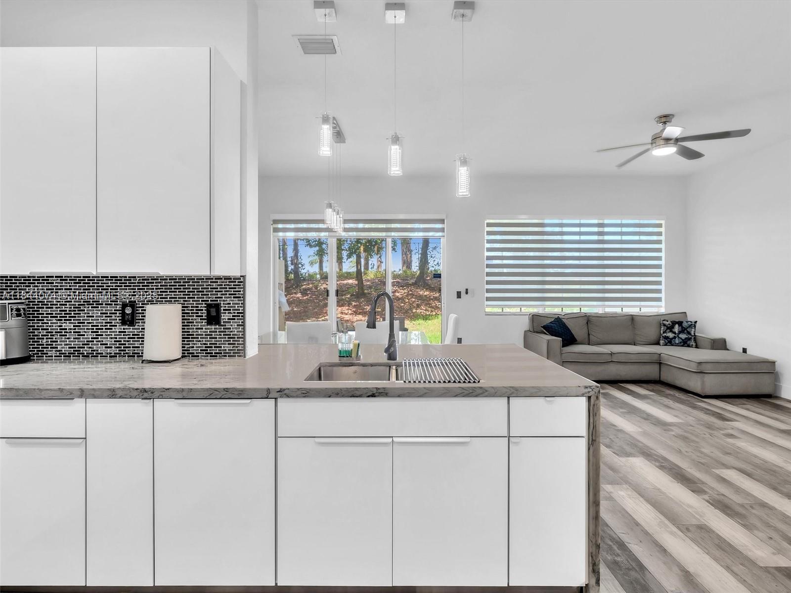 4331 Southwest 124th Way Miramar, FL 33027 - Photo 15 of 58 a kitchen with sink and window