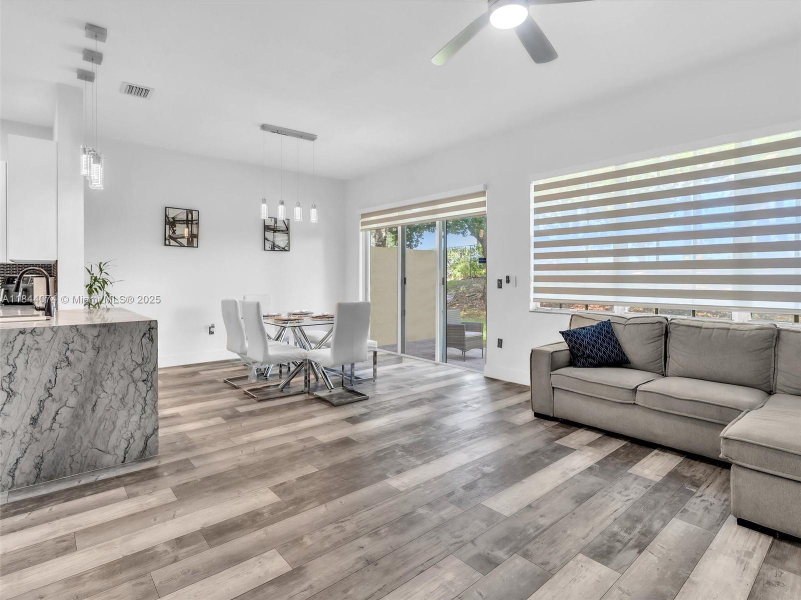 4331 Southwest 124th Way Miramar, FL 33027 - Photo 16 of 58 a living room with furniture and a large window