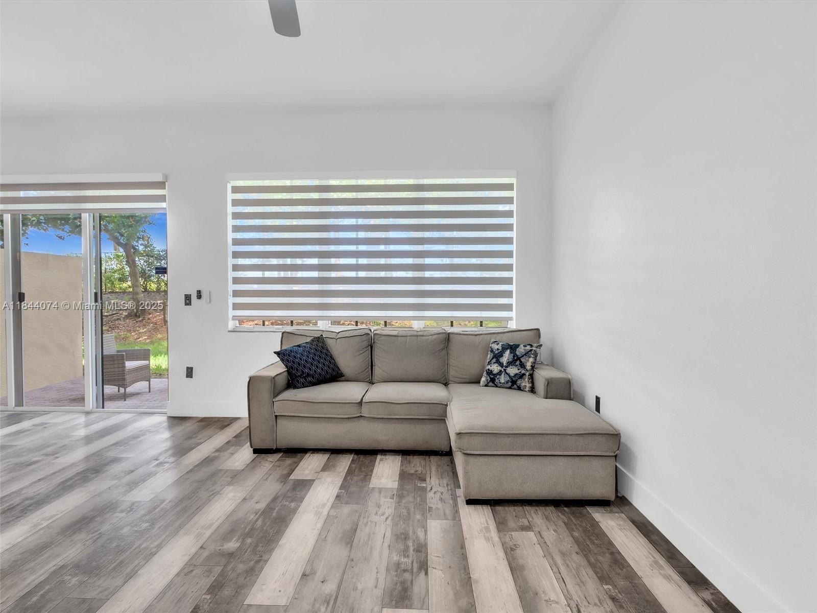 4331 Southwest 124th Way Miramar, FL 33027 - Photo 18 of 58 a living room with furniture and a window