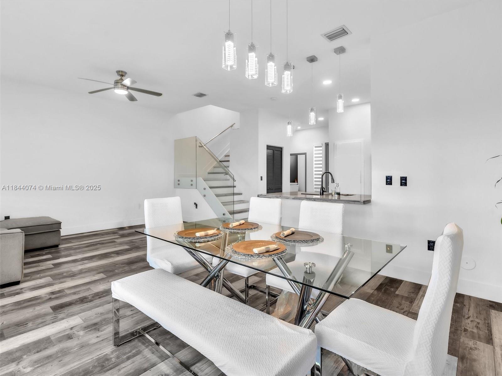 4331 Southwest 124th Way Miramar, FL 33027 - Photo 19 of 58 a living room with furniture and a chandelier