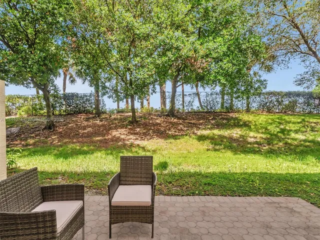 a view of a house with backyard porch and garden