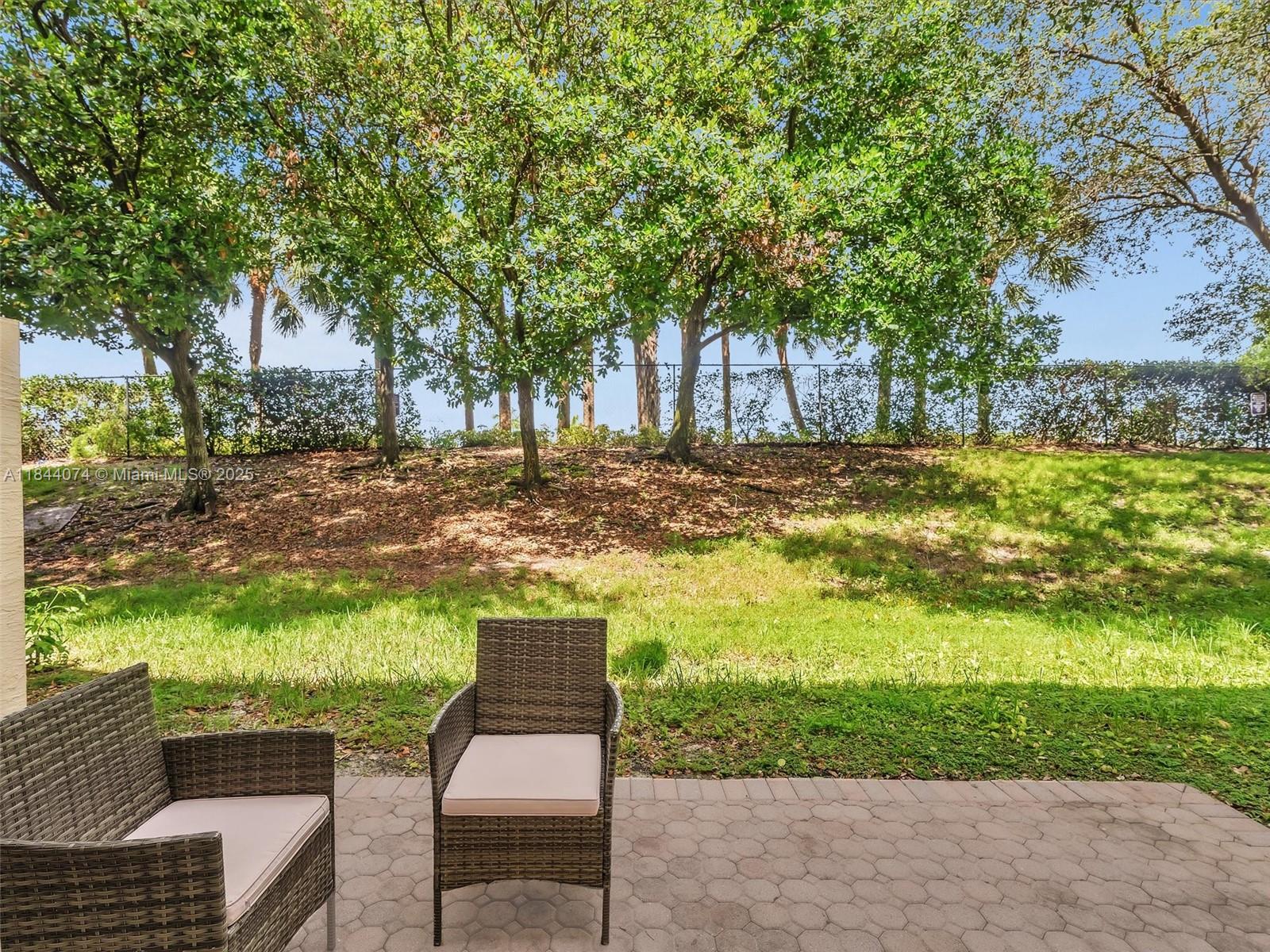 4331 Southwest 124th Way Miramar, FL 33027 - Photo 21 of 58 a view of a yard with plants and trees