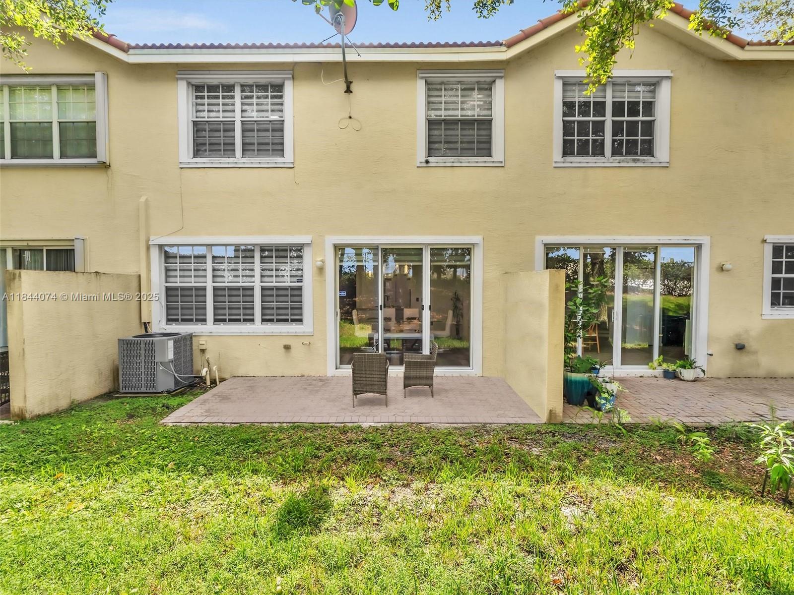 4331 Southwest 124th Way Miramar, FL 33027 - Photo 22 of 58 a front view of a house with a yard